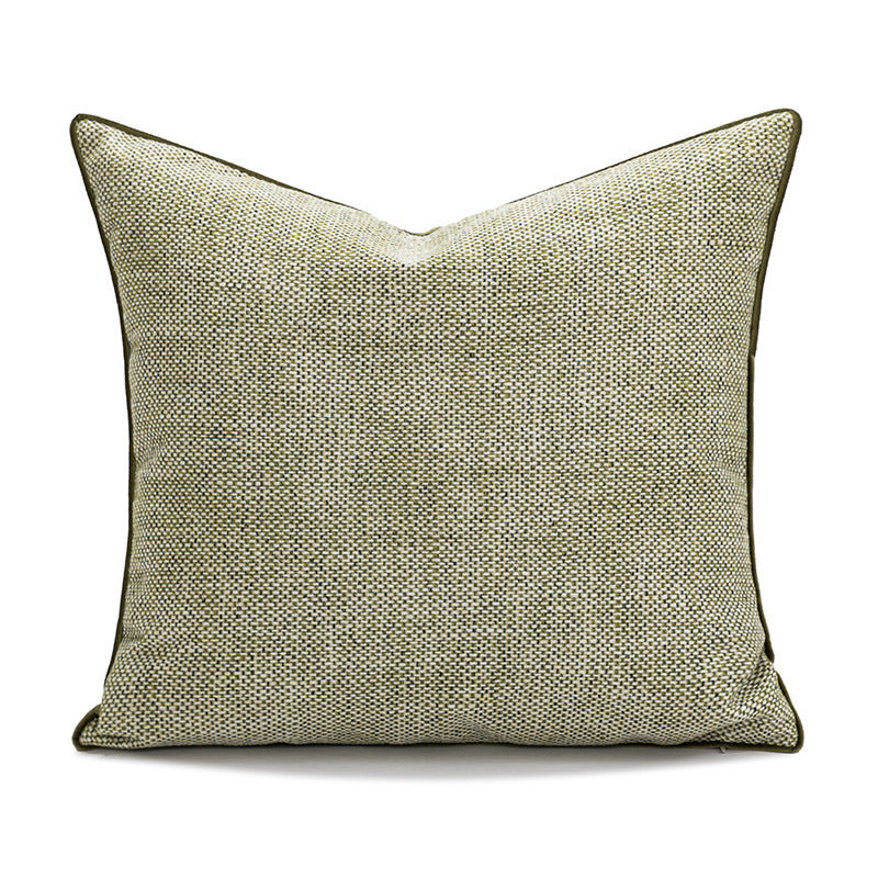 Textured green pillow on a white background