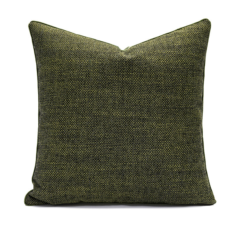 Green textured pillow on a white background