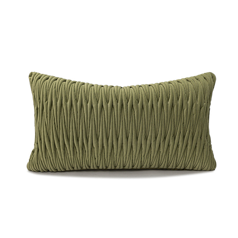 Green textured pillow on a white background